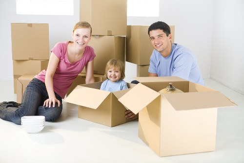 Movers planning a safe home removal with protective equipment