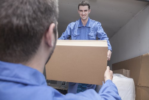 Movers assessing a property safely before lifting and transporting items