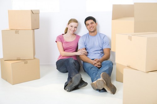 Professional movers handling furniture in a St Johns Wood residence