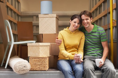 Careful loading of sofas and household furniture into a removals van