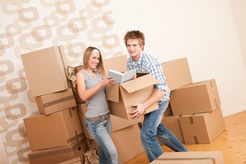 Mover handling protected furniture with care during an internal move