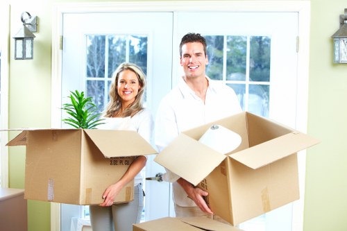 Professional movers protecting furniture during a St Johns Wood flat move