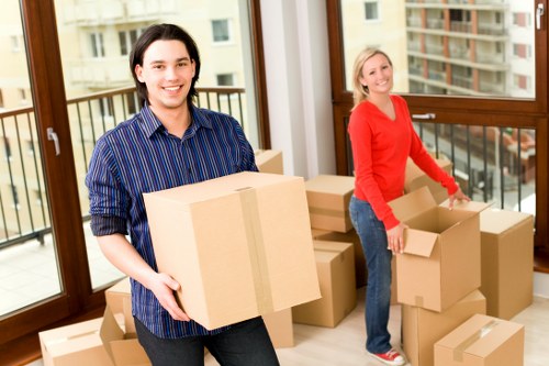 Careful loading of boxes and household items into a van for a St Johns Wood move
